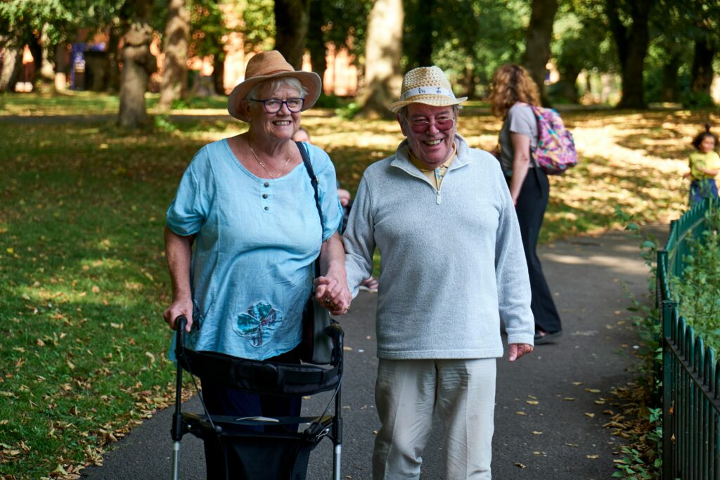 Best walker for seniors with balance issues helping an elderly woman walk safely.